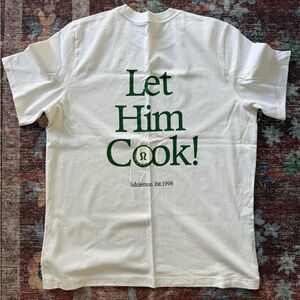 Lululemon men’s golf T-shirt “Let Him Cook”